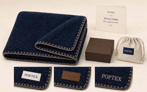 Signature navy blanket with custom branding and gift packaging